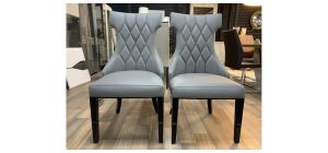 Pair Of Grey Leather Quilted Dining Chairs With Black Lacquer Legs And Details